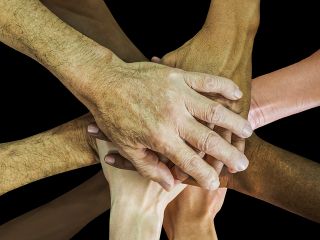 Teamwork: Hände aufeinander